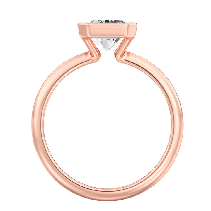 Radiant Cut Lab-Grown Diamond Solitaire Ring in 18K Rose Gold. Features a dazzling radiant cut diamond set in a sleek bezel setting, offering a romantic touch with its soft, pink-toned glow