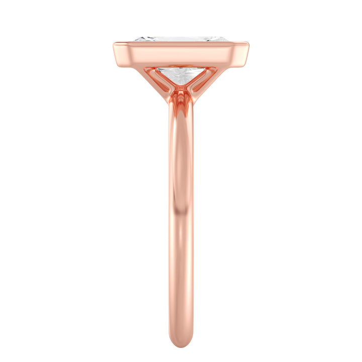 Radiant Cut Lab-Grown Diamond Solitaire Ring in 18K Rose Gold. Features a dazzling radiant cut diamond set in a sleek bezel setting, offering a romantic touch with its soft, pink-toned glow