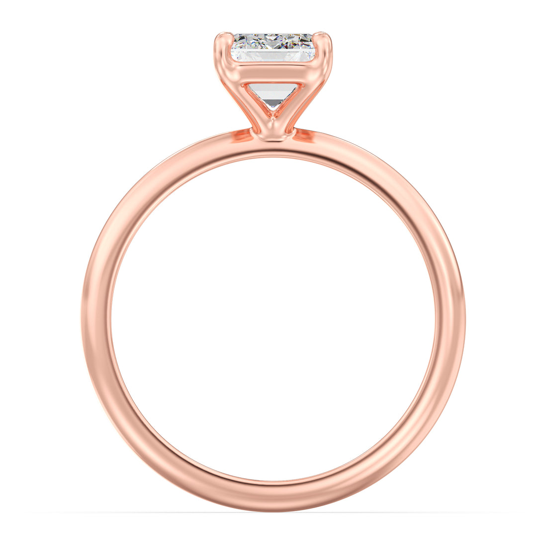 A chic Emerald Cut Lab-Grown Diamond Solitaire Engagement Ring in 18K Rose Gold, highlighting a beautiful emerald cut diamond in a classic 4-claw prong setting