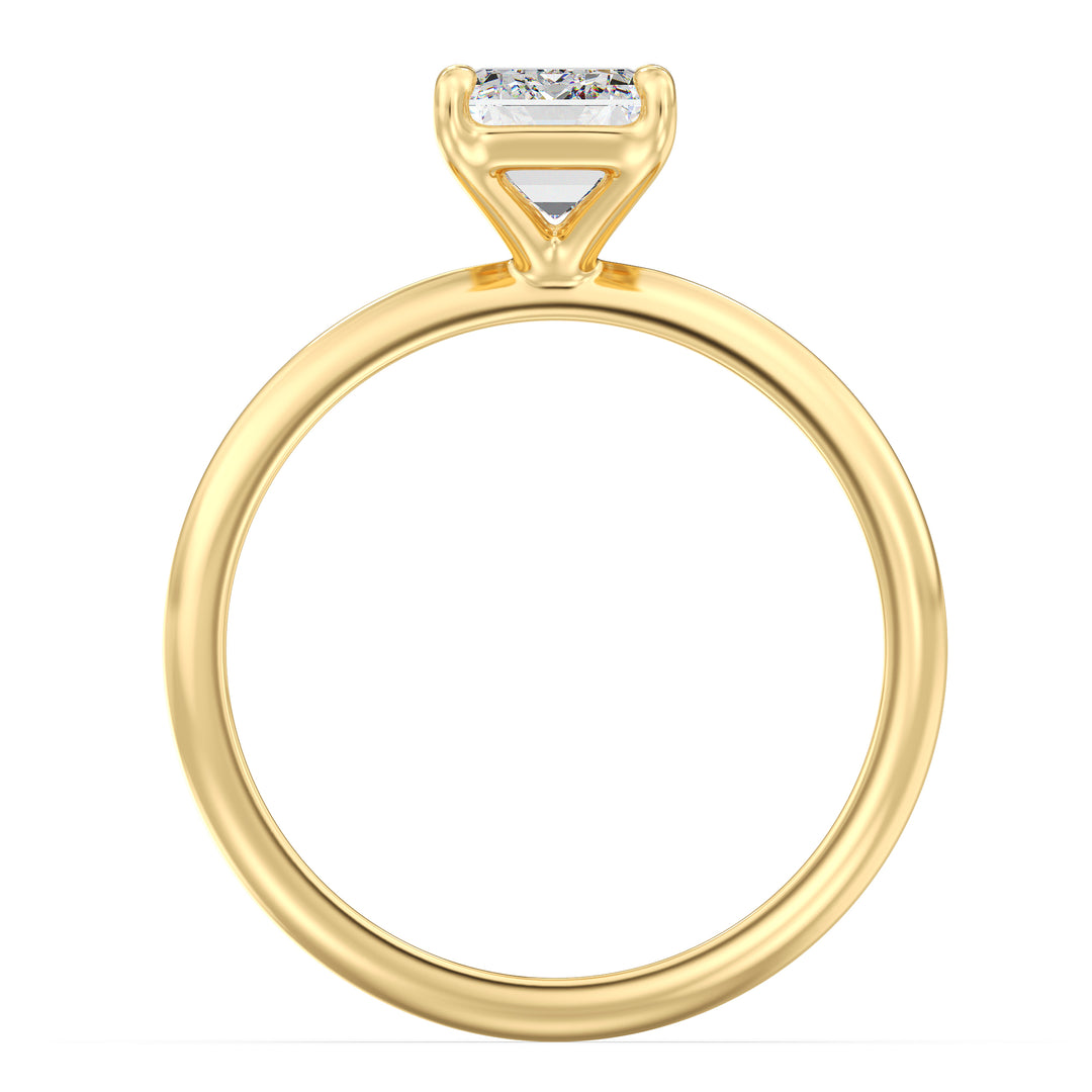 A timeless Emerald Cut Lab-Grown Diamond Solitaire Engagement Ring in 18K Yellow Gold, featuring a stunning emerald cut diamond in a classic 4-claw prong setting