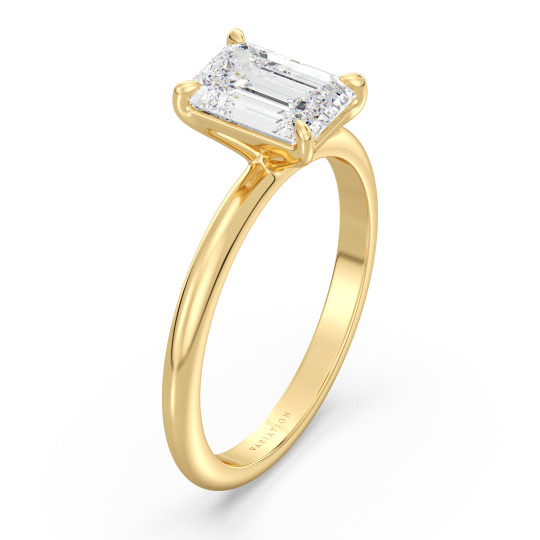 A timeless Emerald Cut Lab-Grown Diamond Solitaire Engagement Ring in 18K Yellow Gold, featuring a stunning emerald cut diamond in a classic 4-claw prong setting