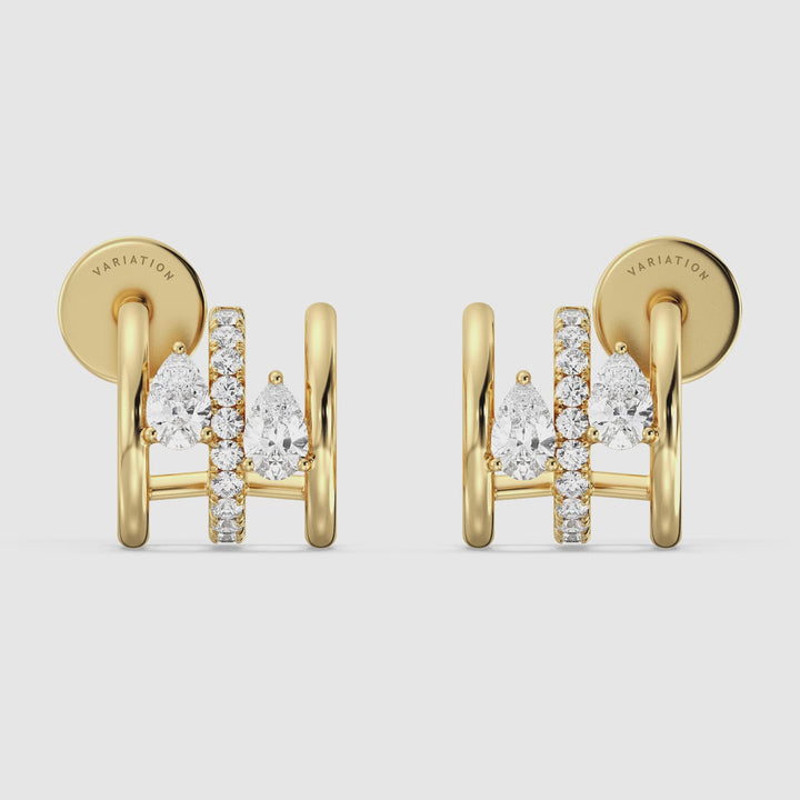 Video showcasing the 18K Yellow Gold Triple Hoop Huggie Earrings adorned with lab-grown diamonds, highlighting the intricate triple hoop design and the sparkle of round and pear-cut diamonds from various angles