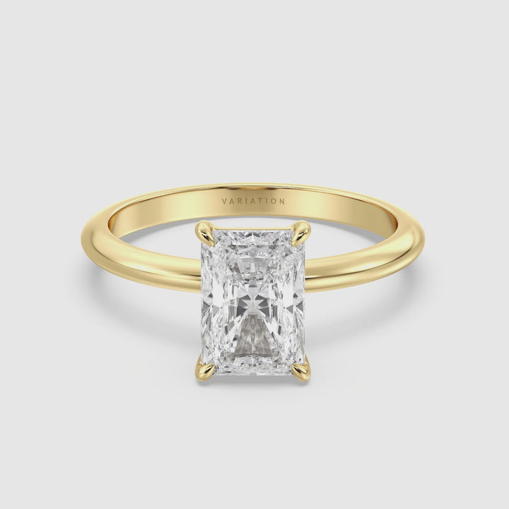 Video showcasing a radiant-cut lab-grown diamond engagement ring with a classic 4-claw prong setting, presented in 18K yellow gold. The video highlights the ring's sparkle and elegant design