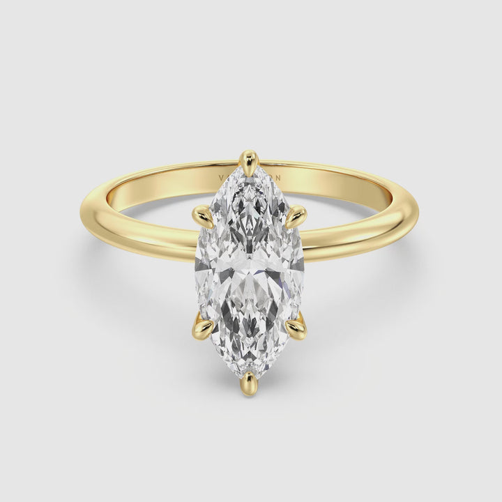 A 360-degree video showcasing the Timeless Marquise Cut Lab-Grown Diamond Solitaire Engagement Ring in 18K Yellow Gold. The marquise-cut diamond sparkles as it catches the light, set in a classic 6-claw prong setting, with options for different carat weights ranging from 1.00ct to 4.00ct