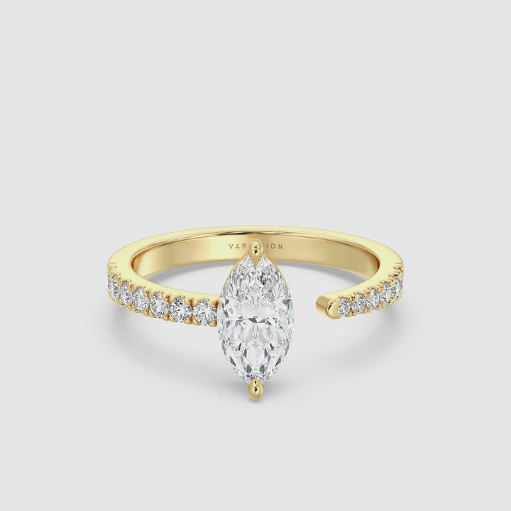 Video showcasing the Elegant Marquise-Cut Lab-Grown Diamond Open Cuff Pavé Engagement Ring in 18K Yellow Gold, featuring a brilliant 1ct marquise-cut center diamond and 0.23ct round pavé side stones, highlighting the open cuff design and sparkling diamond details from various angles